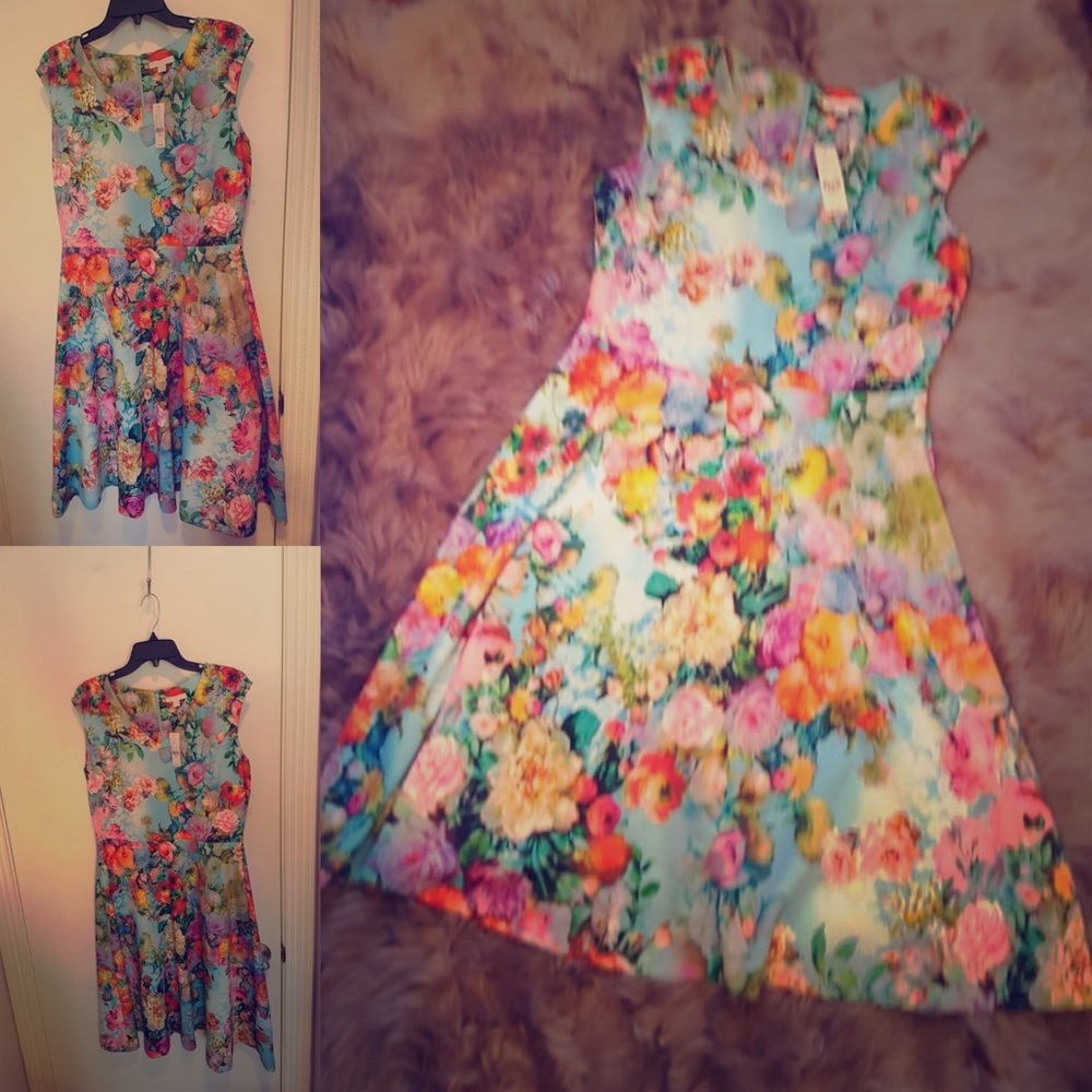 Cocktail dress with roses printed on it.